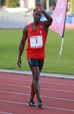 150714 - Welsh Athletics International held at the Cardiff International Sports Stadium - Christian Malcolm thanks the fans after completing his last ever race