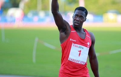 150714 - Welsh Athletics International held at the Cardiff International Sports Stadium - Christian Malcolm thanks the fans after completing his last ever race