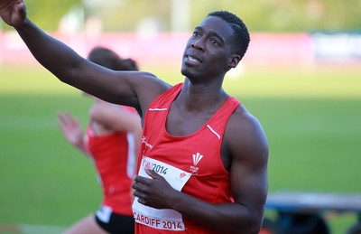 150714 - Welsh Athletics International held at the Cardiff International Sports Stadium - Christian Malcolm thanks the fans after completing his last ever race