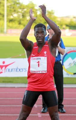 150714 - Welsh Athletics International held at the Cardiff International Sports Stadium - Christian Malcolm thanks the fans after completing his last ever race