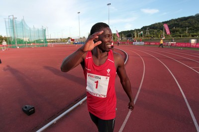 150714 - Welsh Athletics International held at the Cardiff International Sports Stadium - Christian Malcolm thanks the fans after completing his last ever race