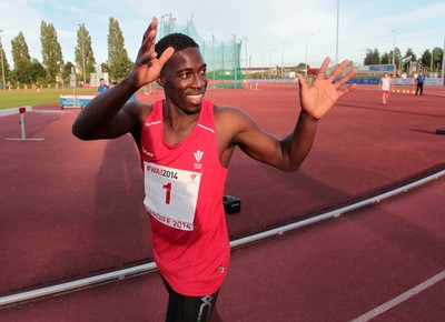 150714 - Welsh Athletics International held at the Cardiff International Sports Stadium - Christian Malcolm thanks the fans after completing his last ever race