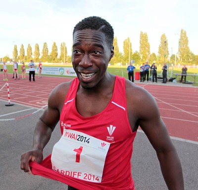 150714 - Welsh Athletics International held at the Cardiff International Sports Stadium - Christian Malcolm thanks the fans after completing his last ever race