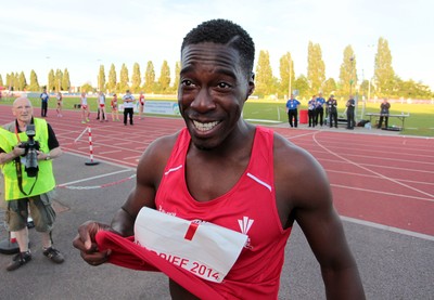 150714 - Welsh Athletics International held at the Cardiff International Sports Stadium - Christian Malcolm thanks the fans after completing his last ever race