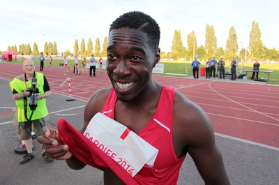 150714 - Welsh Athletics International held at the Cardiff International Sports Stadium - Christian Malcolm thanks the fans after completing his last ever race