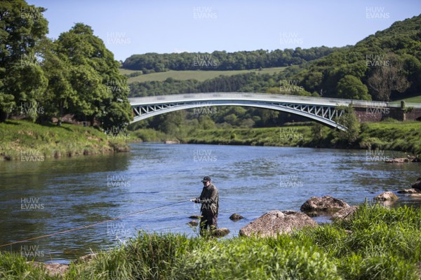 140520 - Picture shows Cledwyn Davies salmon fishing on the picturesque River Wye at Bigsweir Bridge Due to the current Covid-19 restrictions in place in Wales, the river is in a unique position as its split in two for the English and Welsh border Fisherman can travel to the river from England however only fish from the English bank, unable to walk over the bridge to the other side For further comment contact Charles 01594530073