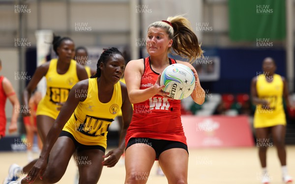 100124 - Welsh Feathers v Uganda, International Netball Series - Bethan Dyke of Welsh Feathers wins the ball