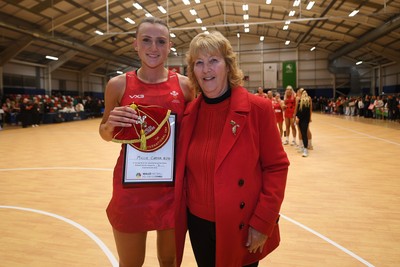 221125 - Welsh Feathers v Zimbabwe Gems - International Netball Match - Millie Carter of Wales gets her first cap