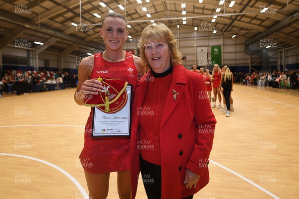 221125 - Welsh Feathers v Zimbabwe Gems - International Netball Match - Millie Carter of Wales gets her first cap