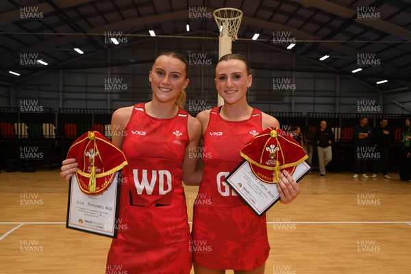 221125 - Welsh Feathers v Zimbabwe Gems - International Netball Match -  Ellie Blackwell of Wales and Millie Carter of Wales get their first caps