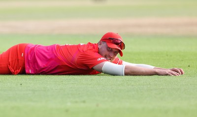 130822 - Welsh Fire Men v Birmingham Phoenix Men, The Hundred - Josh Cobb of Welsh Fire looks on as the ball goes for 4