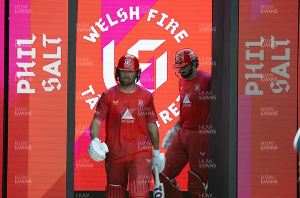 120826 - Welsh Fire Women v London Spirit Women, The Hundred - Phil Salt of Welsh Fire and Matthew Short of Welsh Fire make their way out for the start of their innings