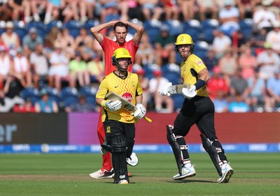 290726 - Welsh Fire Men v Trent Rockets Men, The Hundred - Finn Allen of Trent Rockets and Ben Duckett of Trent Rockets add the runs as Marco Jansen of Welsh Fire looks on