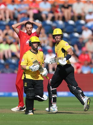 290726 - Welsh Fire Men v Trent Rockets Men, The Hundred - Finn Allen of Trent Rockets and Ben Duckett of Trent Rockets add the runs as Marco Jansen of Welsh Fire looks on