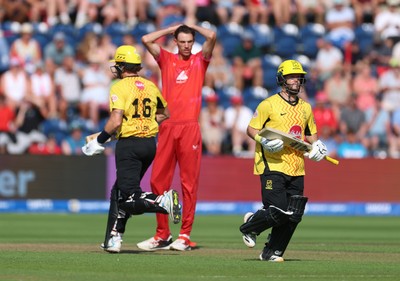 290726 - Welsh Fire Men v Trent Rockets Men, The Hundred - Finn Allen of Trent Rockets and Ben Duckett of Trent Rockets add the runs as Marco Jansen of Welsh Fire looks on