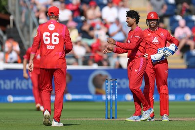 290726 - Welsh Fire Men v Trent Rockets Men, The Hundred - Rachin Ravindra of Welsh Fire celebrates as he dismisses Finn Allen of Trent Rockets
