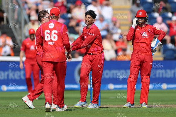 290726 - Welsh Fire Men v Trent Rockets Men, The Hundred - Rachin Ravindra of Welsh Fire celebrates as he dismisses Finn Allen of Trent Rockets