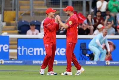 250726 - Welsh Fire v MI London - The Hundred - Jordan Cox of Welsh Fire celebrates with team mates after catching the ball to dismiss Sam Curran off the bowling of Lockie Ferguson