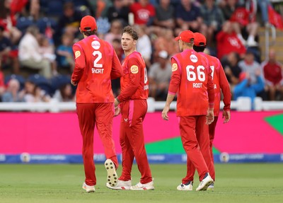 250726 - Welsh Fire v MI London - The Hundred - Jordan Cox of Welsh Fire celebrates with team mates after catching the ball to dismiss Sam Curran off the bowling of Lockie Ferguson