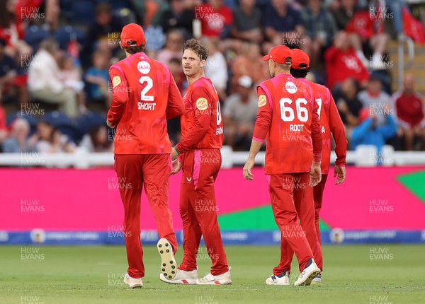 250726 - Welsh Fire v MI London - The Hundred - Jordan Cox of Welsh Fire celebrates with team mates after catching the ball to dismiss Sam Curran off the bowling of Lockie Ferguson
