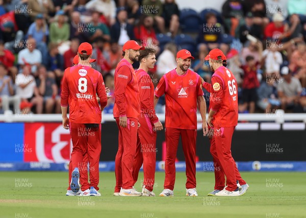 250726 - Welsh Fire v MI London - The Hundred - Jordan Cox of Welsh Fire celebrates with team mates after catching the ball to dismiss Sam Curran off the bowling of Lockie Ferguson