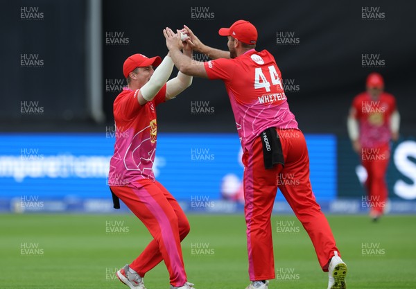 080824 - Welsh Fire Men v Northern Superchargers Men, The Hundred - Tom Abell of Welsh Fire and Ross Whiteley of Welsh Fire celebrate taking the wicket of Harry Brook of Northern Superchargers