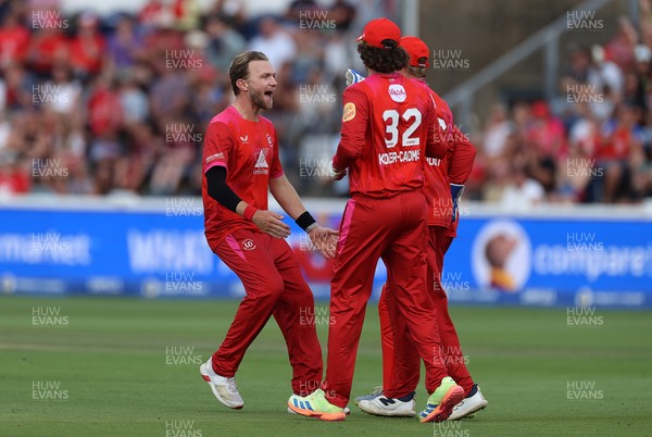 030826 - Welsh Fire v Southern Brave - The Hundred - Sam Cook of Welsh Fire celebrates taking the wicket of Jamie Smith who was caught by Phil Salt