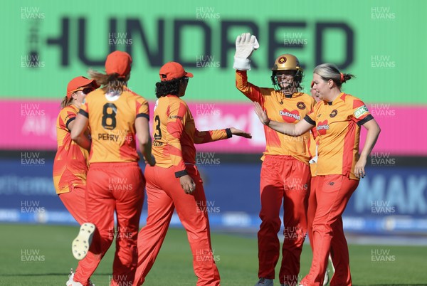 100824 - Welsh Fire v Birmingham Phoenix, The Hundred - Birmingham Phoenix celebrate as they take the wicket of Hayley Matthews of Welsh Fire