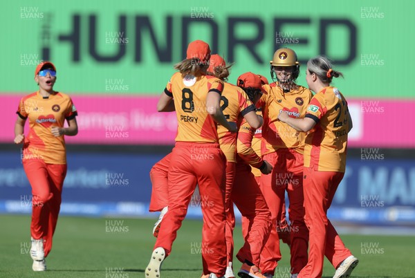 100824 - Welsh Fire v Birmingham Phoenix, The Hundred - Birmingham Phoenix celebrate as they take the wicket of Hayley Matthews of Welsh Fire