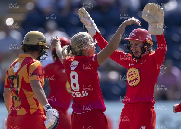 130822 - Welsh Fire Women v Birmingham Phoenix Women, The Hundred - Claire Nicholas of Welsh Fire celebrates with Sarah Bryce of Welsh Fire after taking the wicket of Eve Jones of Birmingham Phoenix