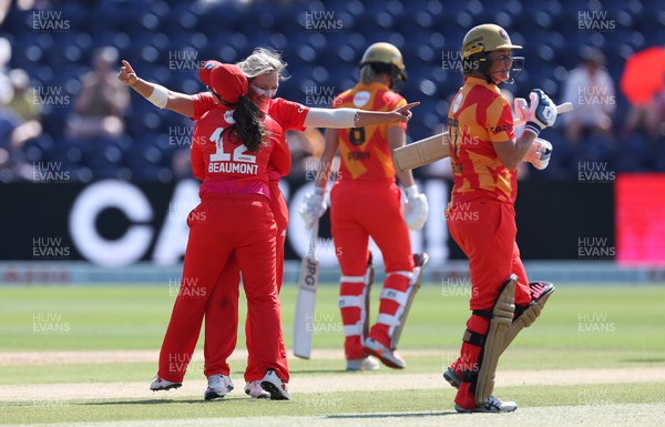 130822 - Welsh Fire Women v Birmingham Phoenix Women, The Hundred - Katie George of Welsh Fire and Tammy Beaumont of Welsh Fire celebrate taking the wicket of Sophie Devine of Birmingham Phoenix