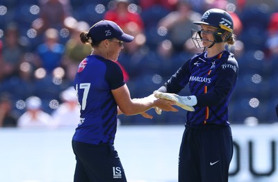 120826 - Welsh Fire Women v London Spirit Women, The Hundred -Grace Harris of London Spirit and Amy Jones of London Spirit celebrate after taking the wicket of Freya Kemp of Welsh Fire