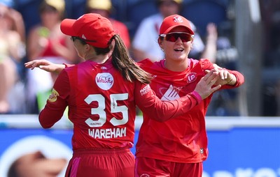 120826 - Welsh Fire Women v London Spirit Women, The Hundred - Abi Norgrove of Welsh Fire celebrates with Georgia Wareham of Welsh Fire after she catches Charlie Dean of London Spirit