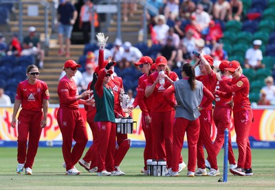 120826 - Welsh Fire Women v London Spirit Women, The Hundred - Welsh Fire celebrate after taking the wicket of Charlie Dean of London Spirit