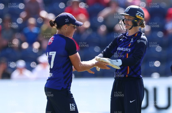 120826 - Welsh Fire Women v London Spirit Women, The Hundred -Grace Harris of London Spirit and Amy Jones of London Spirit celebrate after taking the wicket of Freya Kemp of Welsh Fire