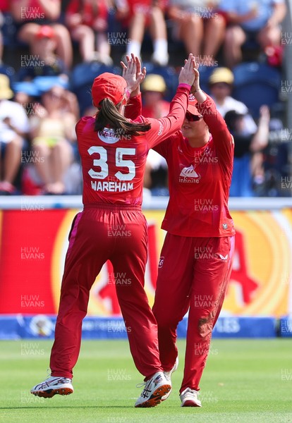 120826 - Welsh Fire Women v London Spirit Women, The Hundred - Abi Norgrove of Welsh Fire celebrates with Georgia Wareham of Welsh Fire after she catches Charlie Dean of London Spirit