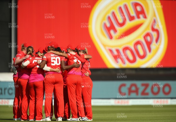 180821 - Welsh Fire Women v London Spirit Women,  The Hundred - Welsh Fire huddle together at the start of the Spirit's innings