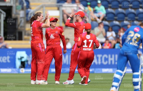 250726 - Welsh Fire Women v MI London Women - The Hundred - Heather Graham of Welsh Fire celebrates with team mates after catching the ball to dismiss Hayley Matthews