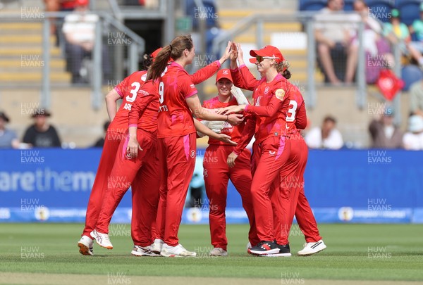 250726 - Welsh Fire Women v MI London Women - The Hundred - Heather Graham of Welsh Fire celebrates with team mates after catching the ball to dismiss Hayley Matthews
