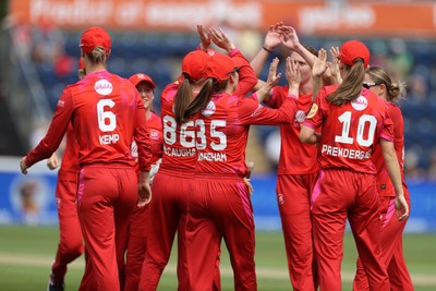 030826 - Welsh Fire Women v Southern Brave Women - The Hundred - Freya Kemp of Welsh Fire celebrates with team mates after catching the ball to dismiss Maia Bouchier