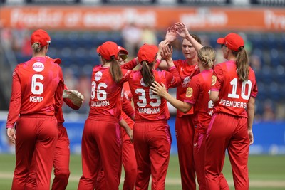030826 - Welsh Fire Women v Southern Brave Women - The Hundred - Freya Kemp of Welsh Fire celebrates with team mates after catching the ball to dismiss Maia Bouchier