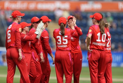 030826 - Welsh Fire Women v Southern Brave Women - The Hundred - Freya Kemp of Welsh Fire celebrates with team mates after catching the ball to dismiss Maia Bouchier