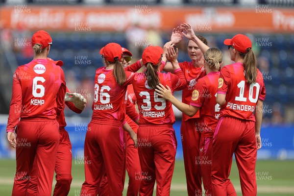 030826 - Welsh Fire Women v Southern Brave Women - The Hundred - Freya Kemp of Welsh Fire celebrates with team mates after catching the ball to dismiss Maia Bouchier