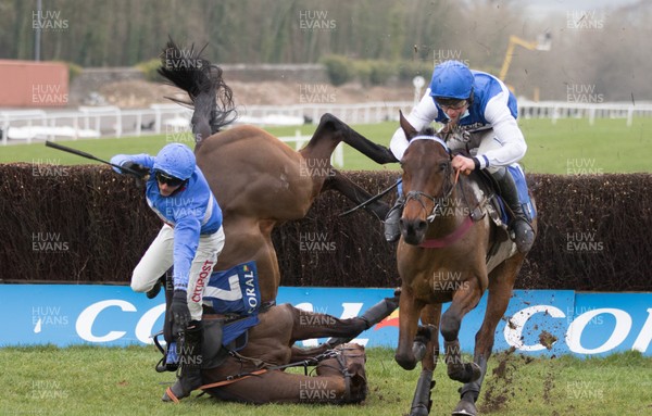 090121 - 2020 Coral Welsh Grand National Meeting - Cepage ridden by Charlie Deutsch, right, comes away to win the second race, The Watch Racing For Free at Coral Handicap Steeple Chase, as Espirit du Large ridden by Adam Wedge take s a fall
