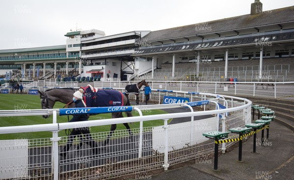 090121 - 2020 Coral Welsh Grand National Meeting - Horses are paraded infront of empty stands at Chepstow Racecourse ahead of one of the races