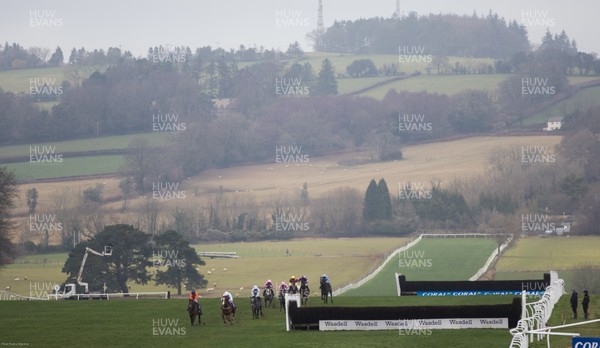 090121 - 2020 Coral Welsh Grand National Meeting - The field makes its way down the home straight in the The Coral Finale Juvenile Hurdle race won by Adagio ridden by Tom Scudamore