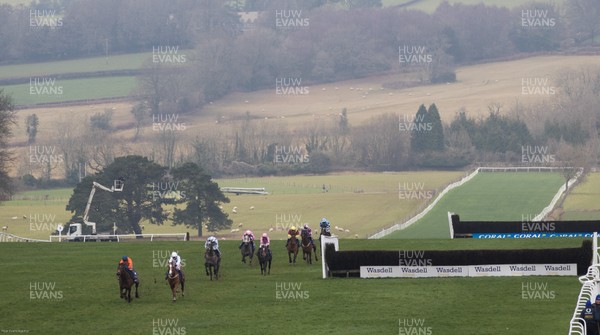 090121 - 2020 Coral Welsh Grand National Meeting - The field makes its way down the home straight in the The Coral Finale Juvenile Hurdle race won by Adagio ridden by Tom Scudamore