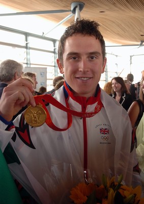 26.08.08 Geriant Thomas shows off his gold medal at celebration for Wales' Olympic athletes at the National Assembly's Sennedd building in Cardiff Bay 