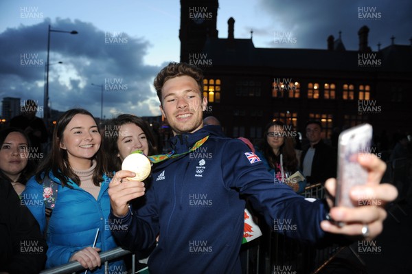 290916 - Olympic and Paralympic Homecoming -Gold medalist Owain Doull meets fans after being welcomed home outside the Senedd, Cardiff Bay