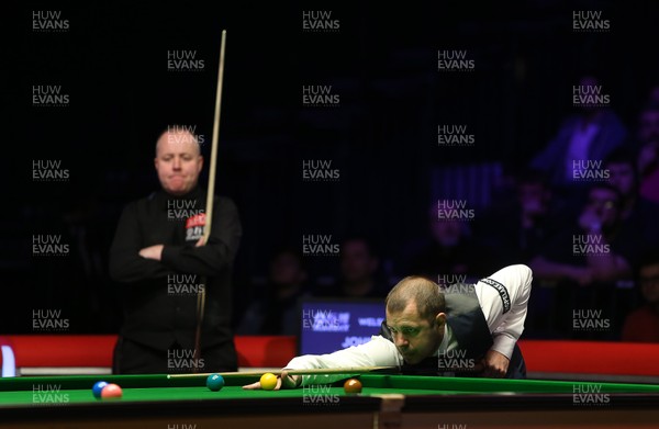 040318 - Welsh Open Snooker Final - John Higgins watches on as Barry Hawkins takes a shot